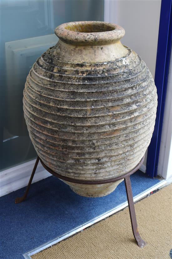 Two terracotta urns on iron stands, H.100cm